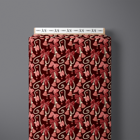 Veloura pure cotton satin fabric bolt with bows, pearls and tassels on rich burgundy